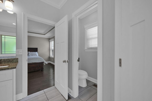 7310 Huntley Ln, Chattanooga, TN 37421 - bathroom featuring vanity, connected bathroom, ornamental molding, and tile patterned flooring