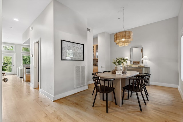 623 Hamilton Ave, Chattanooga, TN 37405 - dining space featuring light wood-type flooring, baseboards, and a chandelier
