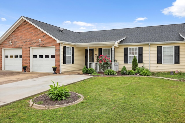 548 Flagstone Dr, Rossville, GA 30741 - view of front of home with a porch, an attached garage, concrete driveway, a front yard, and roof with shingles