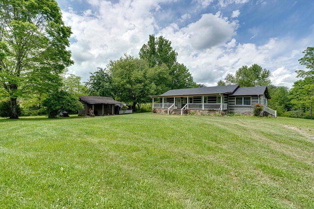 241 Bryant Ln, Tracy City, TN 37387 - view of green lawn with covered porch