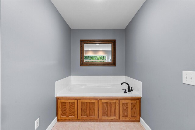 125 Robbie Dr, Whitwell, TN 37397 - bathroom with a bath, baseboards, and tile patterned floors