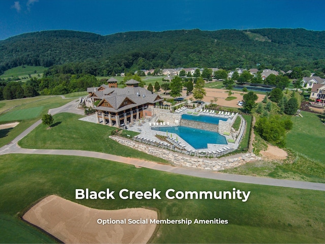 4850 Amethyst Rd Unit 904, Chattanooga, TN 37419 - drone / aerial view of a pool, mountains, and a forest