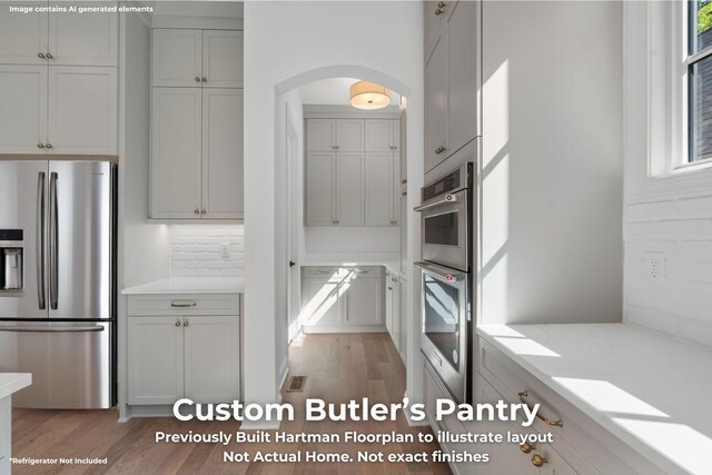3070 Galena Cir Unit 830, Chattanooga, TN 37419 - kitchen featuring stainless steel appliances, light wood-style floors, and arched walkways