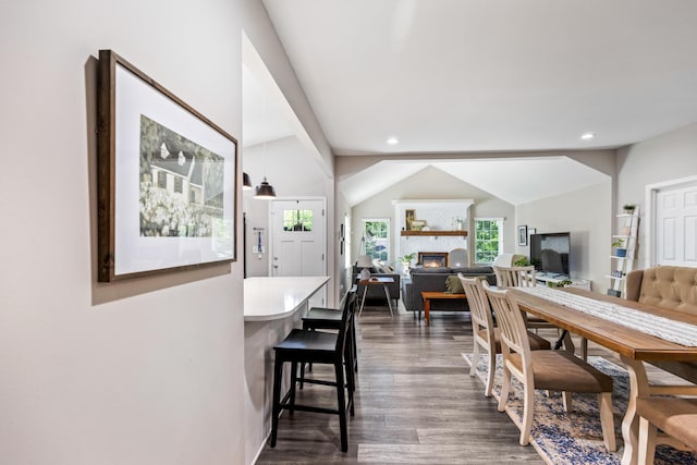 818 Dunlap Ave, Chattanooga, TN 37412 - dining room with dark wood-type flooring, a glass covered fireplace, lofted ceiling, and recessed lighting