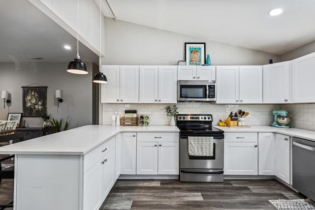 818 Dunlap Ave, Chattanooga, TN 37412 - kitchen with appliances with stainless steel finishes, lofted ceiling, a peninsula, light countertops, and white cabinets