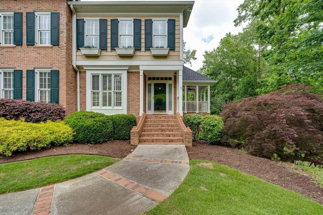 view of front of property featuring brick siding