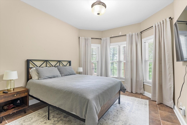 bedroom featuring baseboards