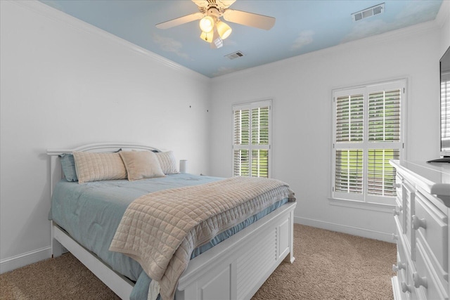 bedroom featuring light carpet, ornamental molding, baseboards, and a ceiling fan