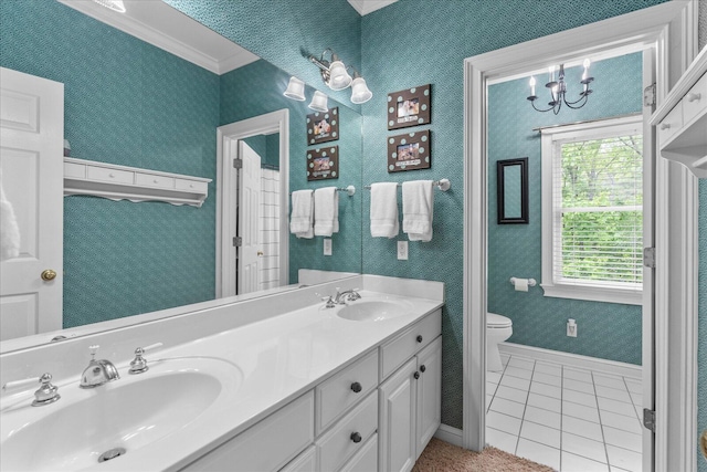 bathroom with tile patterned flooring, toilet, a chandelier, baseboards, and double vanity