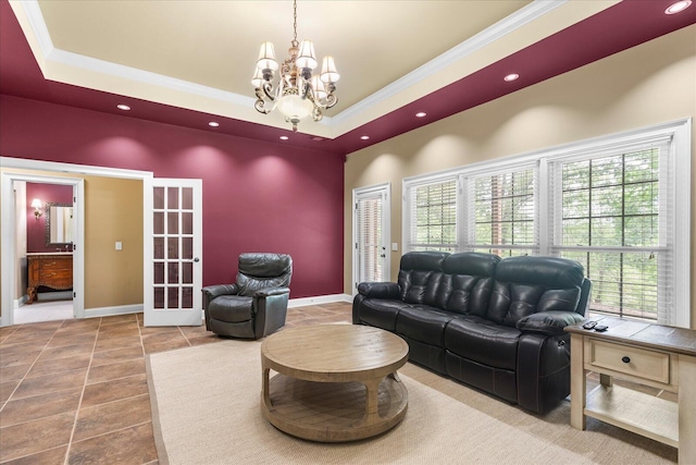 living area with tile patterned flooring, french doors, healthy amount of natural light, recessed lighting, and a chandelier