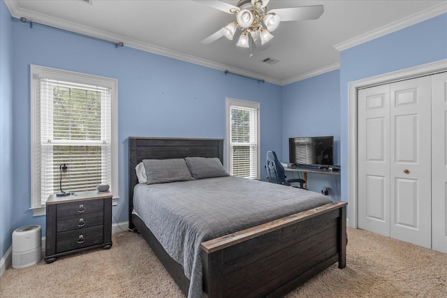 bedroom featuring light carpet, ornamental molding, multiple windows, a closet, and ceiling fan