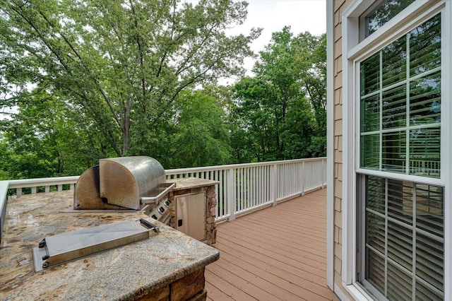 wooden terrace with area for grilling