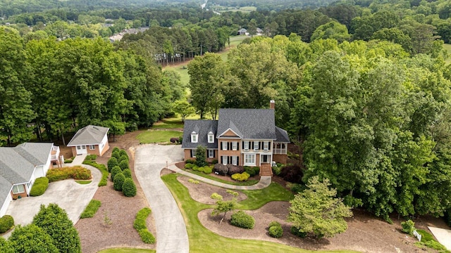 view from above of property with a forest