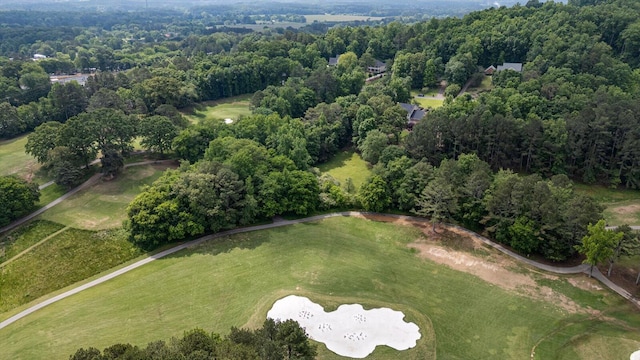 aerial view of property and surrounding area with a golf course