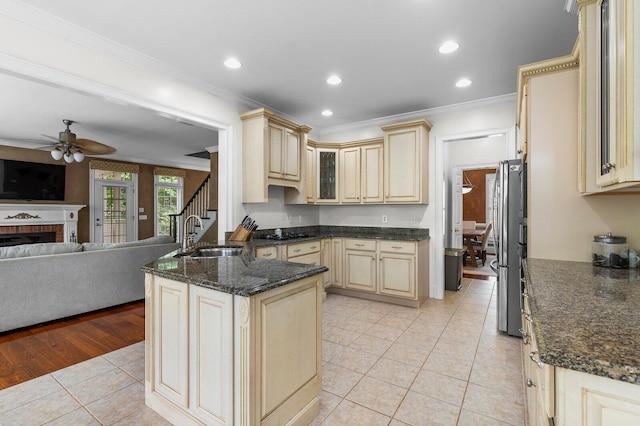 353 Golf View Dr, Cohutta, GA 30710 - kitchen with cream cabinetry, a sink, ornamental molding, open floor plan, and a ceiling fan