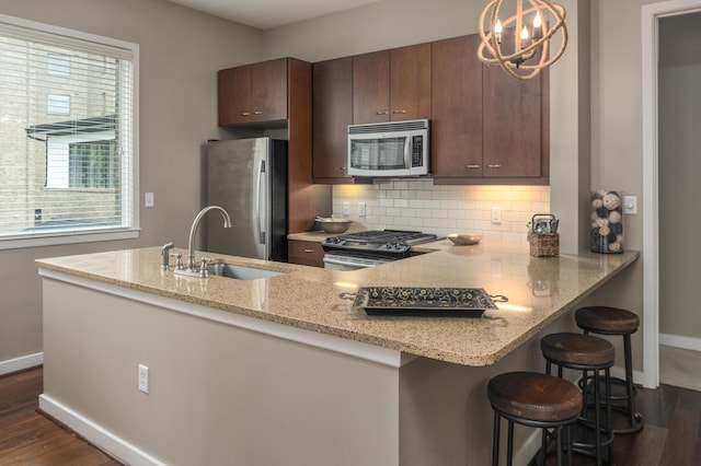 200 Manufacturers Rd Apt 339, Chattanooga, TN 37405 - kitchen with appliances with stainless steel finishes, a sink, dark wood-style floors, and baseboards