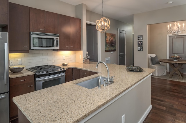 200 Manufacturers Rd Apt 339, Chattanooga, TN 37405 - kitchen featuring stainless steel appliances, a chandelier, a sink, and dark wood-style flooring