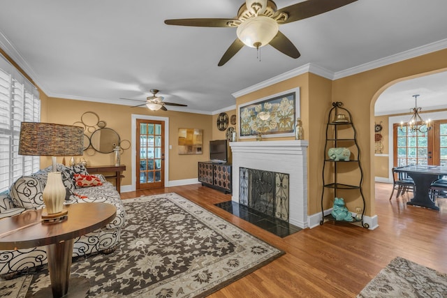 122 Hilltop Dr, Chattanooga, TN 37411 - living area featuring wood finished floors, a ceiling fan, baseboards, a chandelier, and ornamental molding