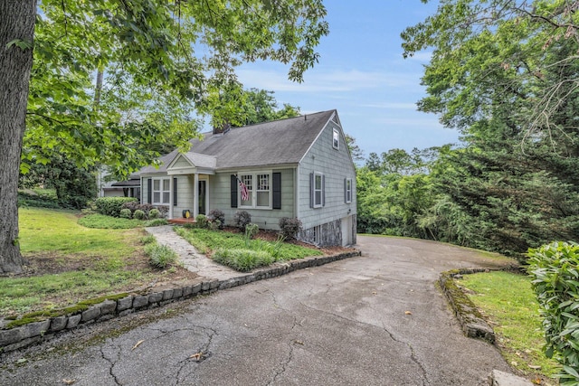 122 Hilltop Dr, Chattanooga, TN 37411 - view of front of house with driveway, a garage, and a shingled roof