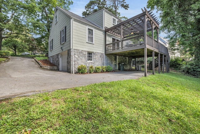 122 Hilltop Dr, Chattanooga, TN 37411 - rear view of house featuring driveway, a pergola, a garage, and a deck