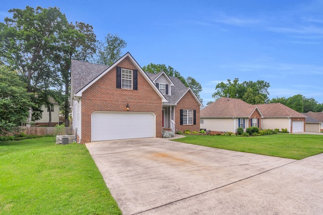 8369 Shadetree Ln, Ooltewah, TN 37363 - traditional-style home featuring brick siding, driveway, central AC, and a shingled roof