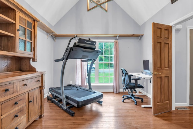 8369 Shadetree Ln, Ooltewah, TN 37363 - workout room with lofted ceiling, light wood finished floors, and baseboards