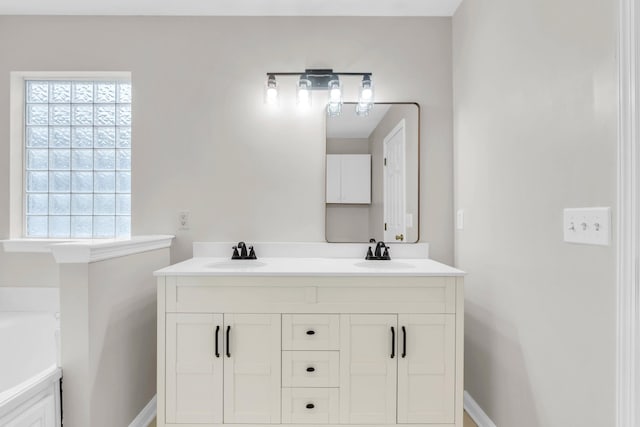 8369 Shadetree Ln, Ooltewah, TN 37363 - full bathroom with plenty of natural light, double vanity, a tub, and baseboards