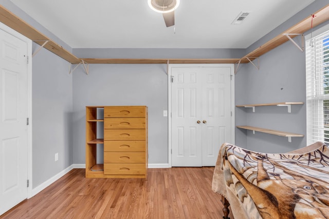 8369 Shadetree Ln, Ooltewah, TN 37363 - bedroom with light wood-style flooring, baseboards, a ceiling fan, and a closet