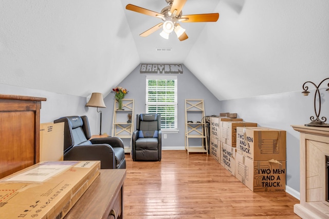 8369 Shadetree Ln, Ooltewah, TN 37363 - living area with light wood-style floors, lofted ceiling, a ceiling fan, and baseboards