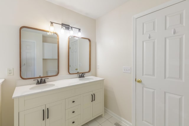 8369 Shadetree Ln, Ooltewah, TN 37363 - full bathroom featuring double vanity, tile patterned floors, and baseboards