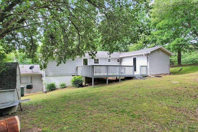 back of house with a yard and a deck