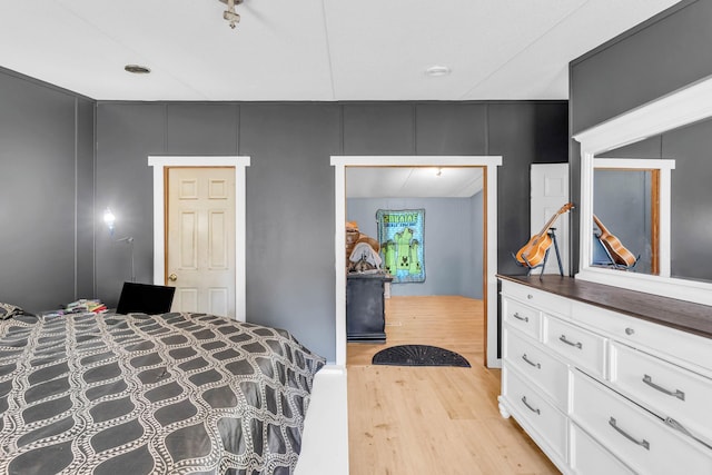 3250 Rolling Meadows Rd NW, Dalton, GA 30721 - bedroom with light wood-style floors and a decorative wall