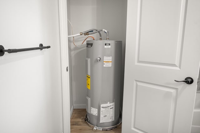 utility room featuring water heater