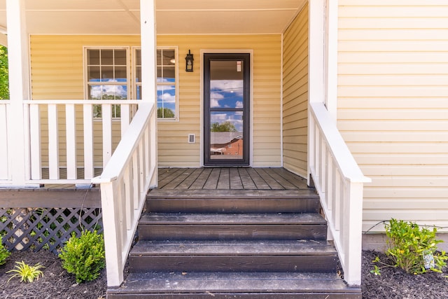doorway to property featuring covered porch