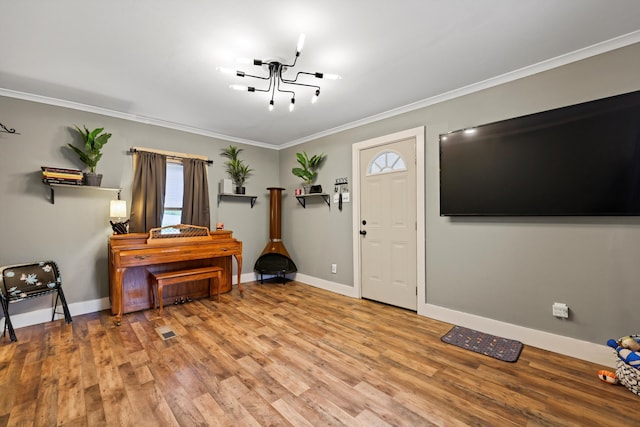 150 SE Fair St, Cleveland, TN 37311 - entrance foyer featuring wood finished floors, crown molding, and baseboards