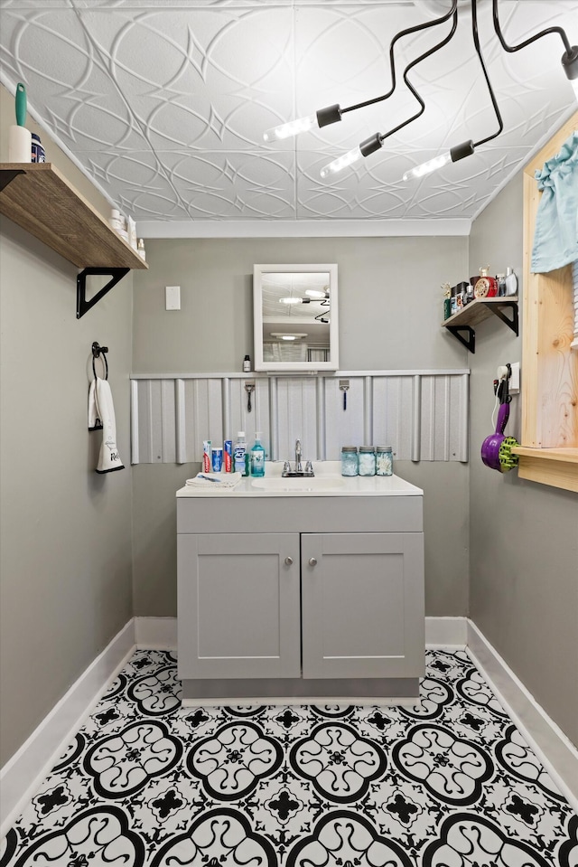 150 SE Fair St, Cleveland, TN 37311 - bathroom featuring baseboards, vanity, and tile patterned floors