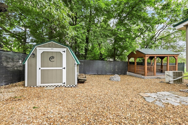 150 SE Fair St, Cleveland, TN 37311 - view of shed with central air condition unit, a gazebo, and a fenced backyard