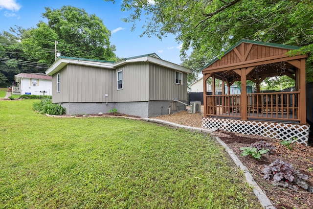 150 SE Fair St, Cleveland, TN 37311 - view of side of property with a gazebo, a lawn, and cooling unit