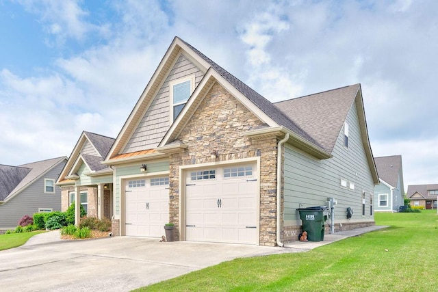 536 Live Oak Rd, Ringgold, GA 30736 - view of property exterior with driveway, stone siding, a garage, a lawn, and a shingled roof