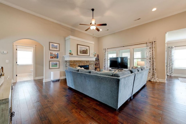 536 Live Oak Rd, Ringgold, GA 30736 - living room featuring a ceiling fan, dark wood finished floors, a stone fireplace, arched walkways, and baseboards