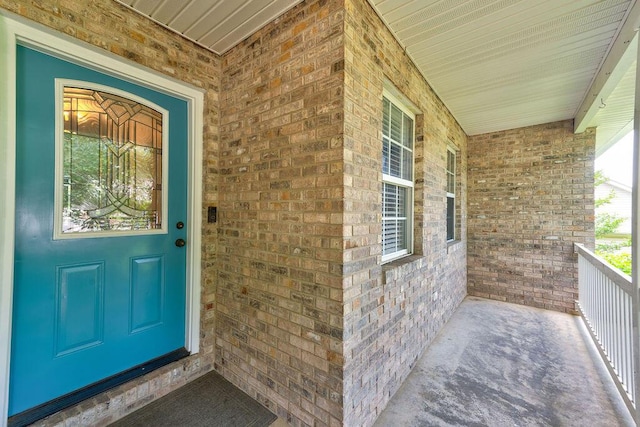 5040 Dellwood Dr, Rossville, GA 30741 - property entrance featuring covered porch and brick siding