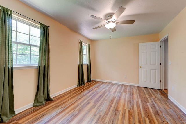 5040 Dellwood Dr, Rossville, GA 30741 - unfurnished room featuring light wood-style flooring, ceiling fan, and baseboards