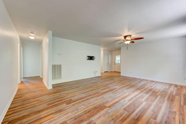 5040 Dellwood Dr, Rossville, GA 30741 - spare room featuring light wood-style flooring, ceiling fan, and baseboards