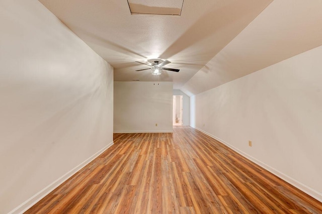5040 Dellwood Dr, Rossville, GA 30741 - additional living space featuring light wood-style floors, baseboards, ceiling fan, and vaulted ceiling