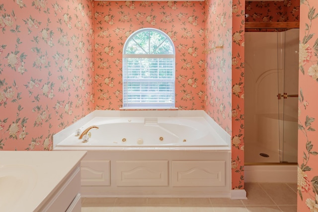 full bathroom featuring a shower stall, wallpapered walls, a jetted tub, tile patterned flooring, and vanity