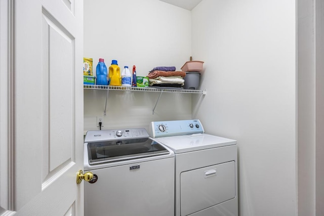 laundry area with washer and clothes dryer