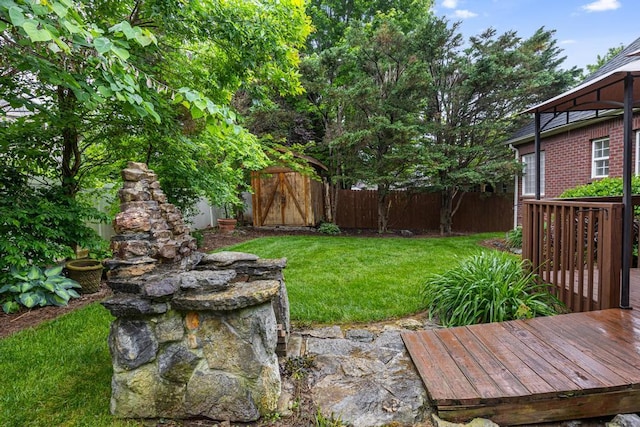 view of yard featuring a wooden deck