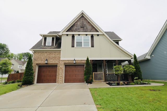 craftsman-style home featuring driveway, a front lawn, an attached garage, board and batten siding, and roof with shingles