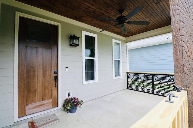 property entrance featuring a porch and a ceiling fan