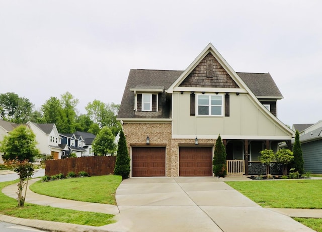craftsman-style home with board and batten siding, driveway, a garage, and a shingled roof